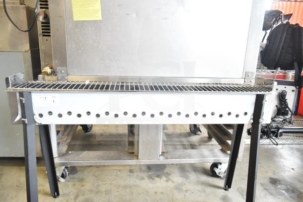 BRAND NEW Backyard Pro KEBAB-46 stainless steel charcoal kebab grill, 45 3/8" with minor scratches, sturdy design.