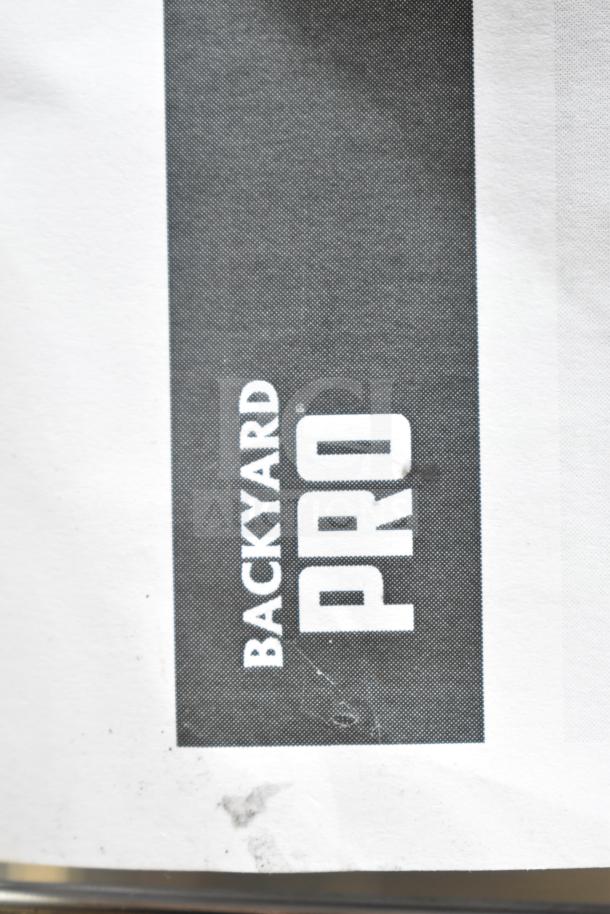 BRAND NEW Backyard Pro KEBAB-46 45 3/8" stainless steel charcoal kebab grill label, showing minor scratches.