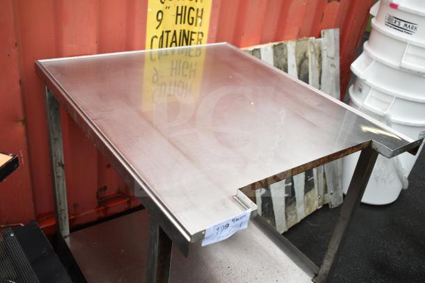 Commercial table with stainless steel top and rust on supports, includes an under shelf. Price tag marked $199.