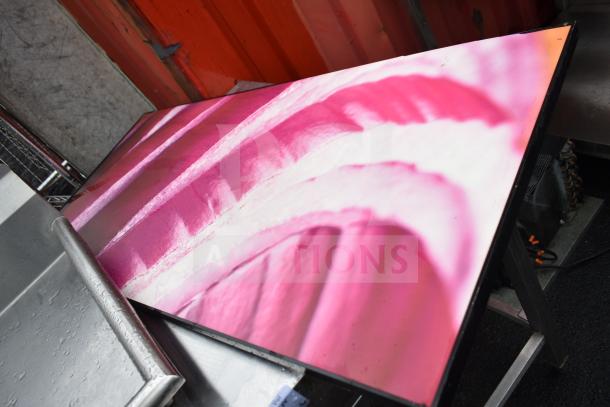 Commercial table featuring a vibrant onion-themed picture on its surface, in good condition.