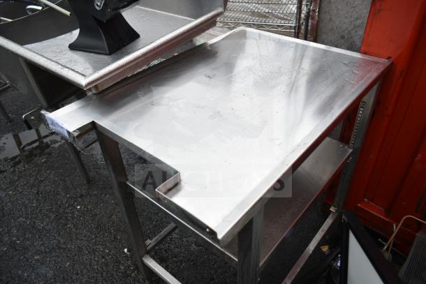 Stainless steel commercial table with undershelf, used condition, includes mounted onion picture.