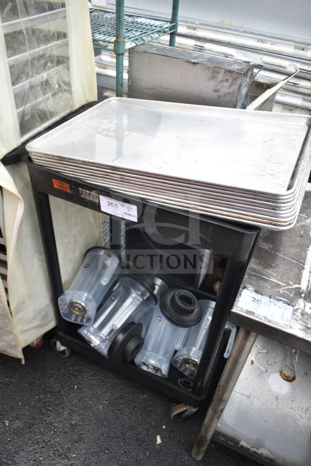 Black two-tier poly cart holding baking pans and blender pitchers. Visible labels suggest contents included. Good condition.