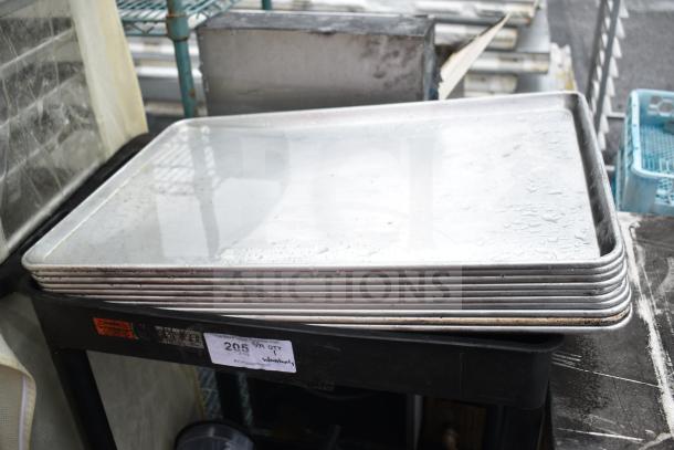 Black poly 2-tier cart with baking pans, visible label reads "Lot 205", includes blender pitchers. Used condition.