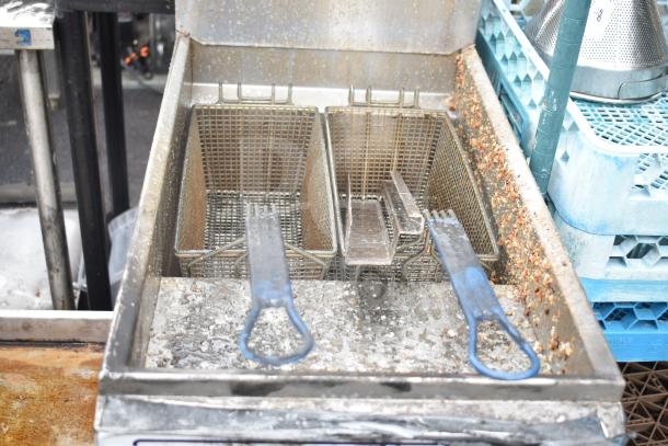 Imperial IFS-40-E commercial electric deep fryer with dual baskets; visible wear and residue; 208V, 3-phase.