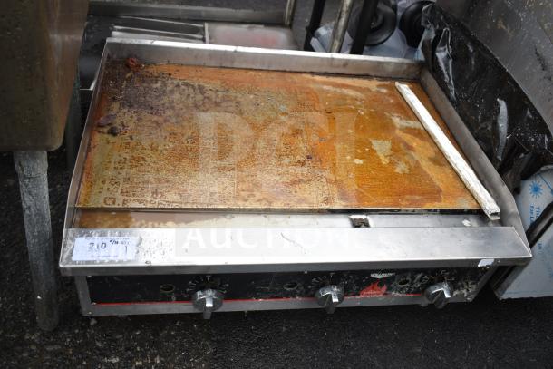 Vollrath Cayenne commercial gas griddle with thermostatic controls, visibly worn surface, model tag shown.