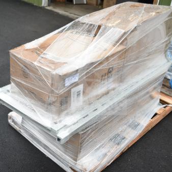 Four new scratch and dent items on a pallet, including a Glad step pedal trash can. Boxed and plastic-wrapped for auction, label showing "273".