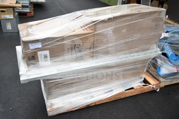 Shrink-wrapped pallet with brand new scratch and dent items, including Glad step pedal trash can. Labels visible.
