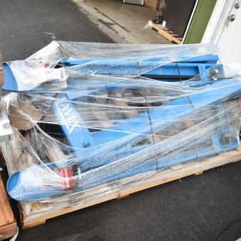 Brand new Lavex 481XN25DF1600 manual pallet jack, 27" x 63" forks, 5,500 lb. capacity, wrapped in plastic, visible brand marking.