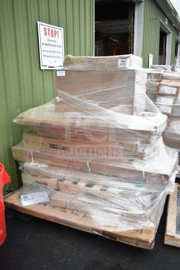 Stack of packaged items including folding table and umbrella frame. Labeled as "14 BRAND NEW SCRATCH AND DENT!"