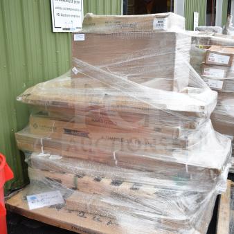 Stack of packaged items including folding table and umbrella frame. Labeled as "14 BRAND NEW SCRATCH AND DENT!"