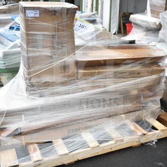 Stack of 8 new scratch and dent items including shelves, bar stool, and speed rail, wrapped on a pallet. Labels visible.