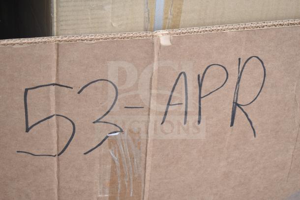 Cardboard box with handwritten label "53-APR," containing 8 new scratch and dent items, including an ice bin and tabletop.