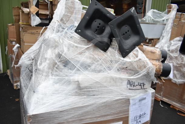 11 new scratch and dent items, including table base pieces and a blue chair, wrapped in plastic. Marking: "APR-47".