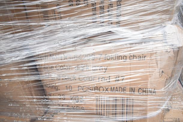 Pallet wrapped in plastic containing boxes labeled "folding chairs," new condition with scratches or dents, various colors.