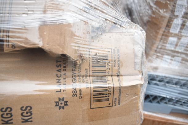 Pallet of 17 new scratch and dent folding chairs by Lancaster Table & Seating in damaged boxes, plastic wrapped.
