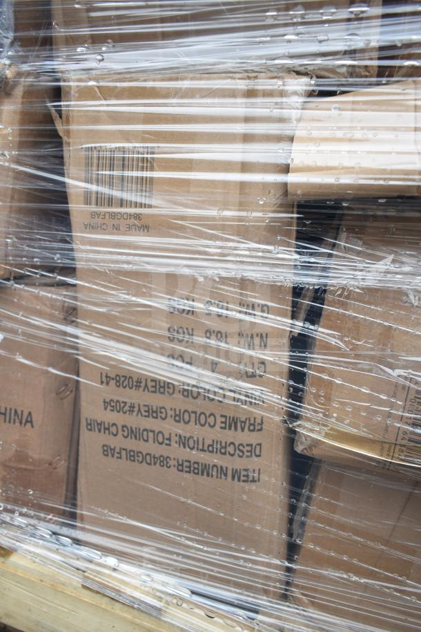 Pallet of boxed folding chairs wrapped in plastic. Boxes show product details like color and item number. Some minor wear visible.