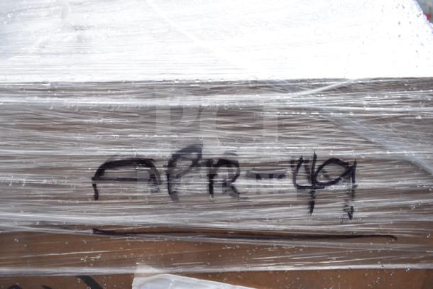 Wrapped pallet labeled "APR-49" containing 15 new scratch and dent items, including chair and liquor display rack.