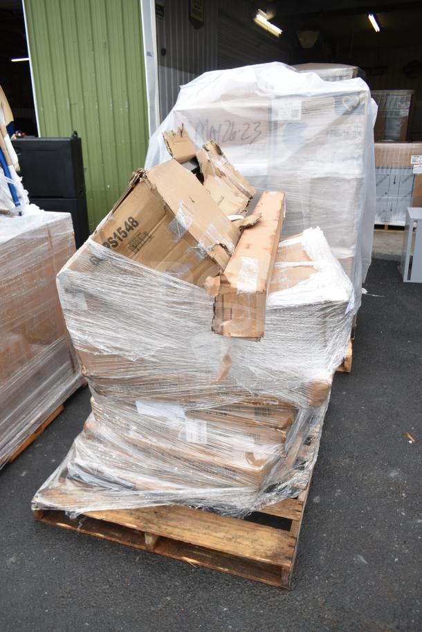 9 scratch and dent items, including Flash Furniture Lars 30" round birchwood cocktail table, on a pallet with packaging.