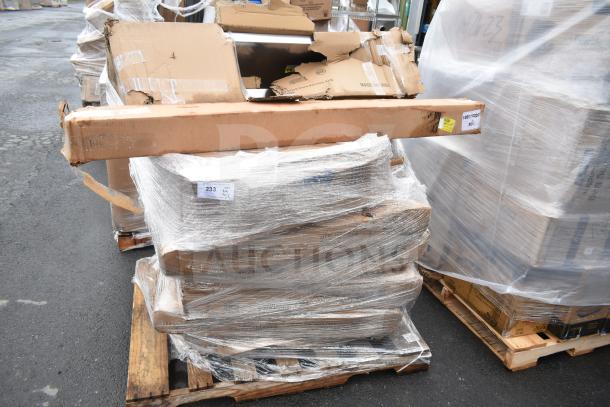 9 new scratch and dent items on a pallet, including Flash Furniture Lars tables in boxes, some damage visible.