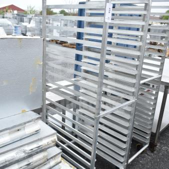 Commercial pan transport rack with multiple shelves, on commercial casters. Metal construction, good condition, tag number 235.