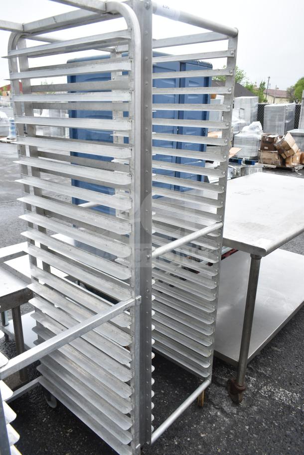 Commercial pan transport rack with multiple shelves, on sturdy commercial casters. Suitable for industrial kitchen use.