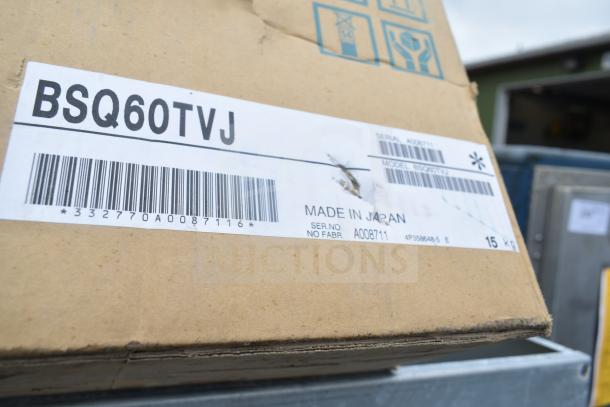 Cardboard box labeled BSQ60TVJ; includes barcode, made in Japan, serial no. A008711. Contains multiple various items.