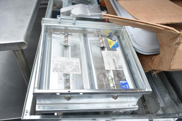 13 various HVAC items including BSQ60TVJ branch box and Greenheck fire damper. Some items labeled. Auction lot.