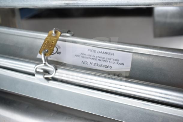 Fire damper with 1.5-hour fire resistance rating, static system use, label No. H 23384065, part of 13-item auction.