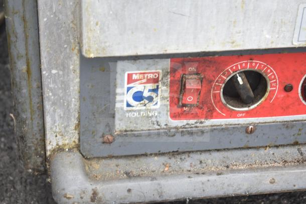Metro C539-HDS-4-BU heated holding cabinet on wheels, 120V, 1 phase, red control panel with on/off switch, used condition.