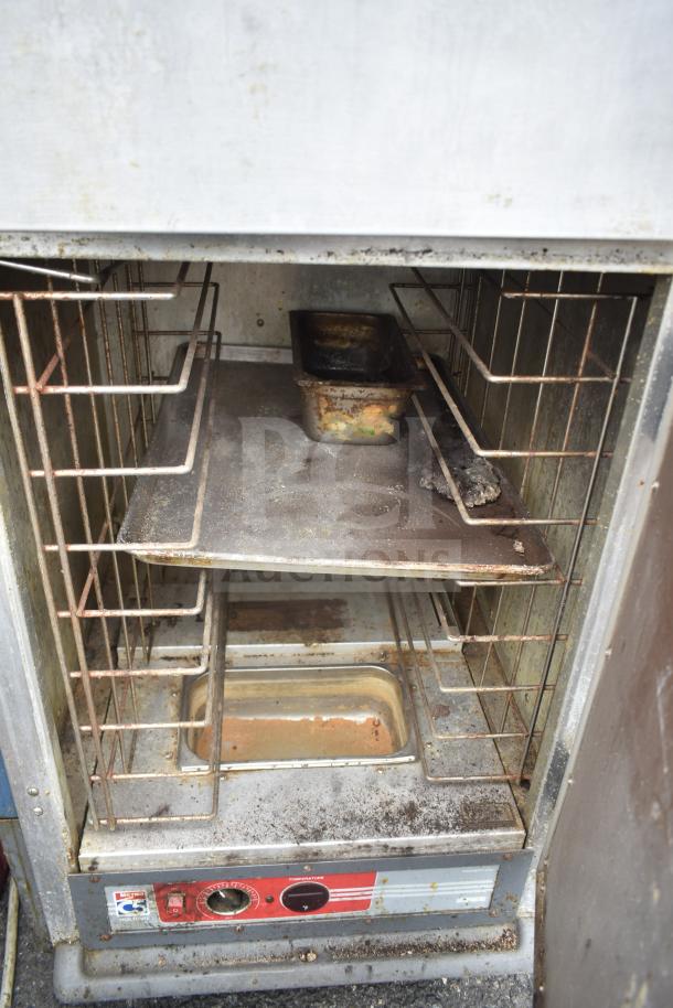 Metro C539-HDS-4-BU heated holding cabinet; visible rust and wear; commercial casters; 120V, 1 phase.