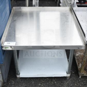 Regency 600ES3030G equipment stand with under shelf, stainless steel, used condition, metal legs, auction tag visible.