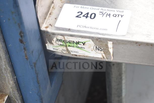 Regency 600ES3030G stainless steel equipment stand with under shelf, visible wear, and model label.