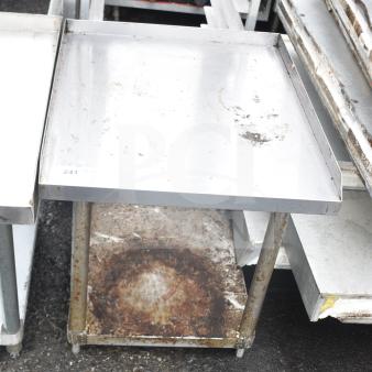 Commercial equipment stand with under shelf, metallic finish, used condition, visible rust and wear.