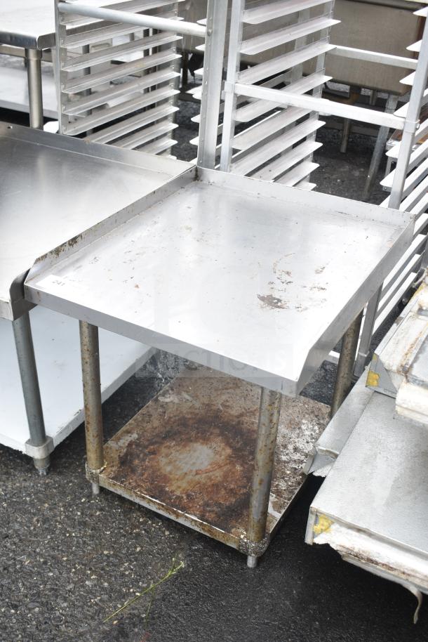 Commercial equipment stand with under shelf, stainless steel, used condition, visible wear and rust on lower shelf.