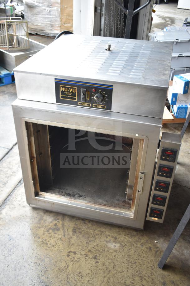 Nu Vu PMA-5/18 commercial oven, 208V, 3 phase, missing glass. Features control dials, stainless steel exterior.