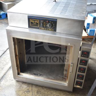 Nu Vu PMA-5/18 commercial oven, 208V, 3 phase, missing glass. Features control dials, stainless steel exterior.