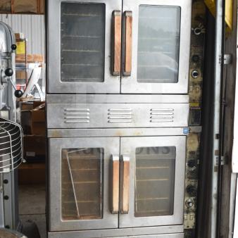 Two Vulcan commercial full-size convection ovens with view-through doors and thermostatic controls. Good condition.