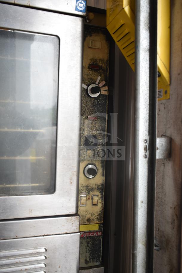 Vulcan commercial convection oven with view-through door, thermostatic controls, stainless steel exterior, moderate wear.