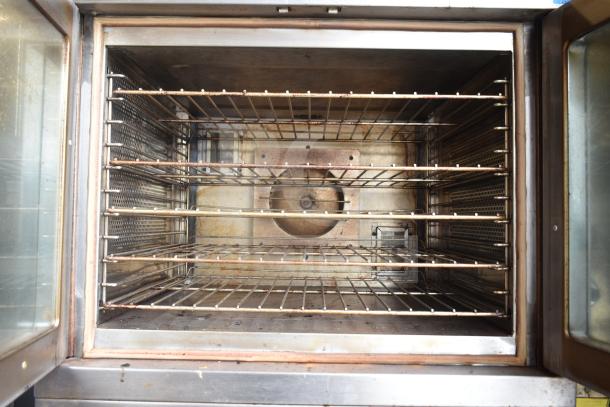 Vulcan commercial full-size convection oven with view-through doors, thermostatic controls, and multiple racks. Used condition.