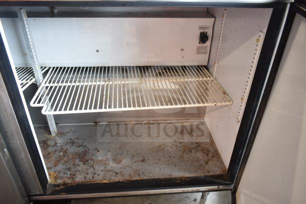 True TWT-60 commercial 2-door work top cooler with shelf, 115 volts, 1 phase. Some interior rust and wear visible.