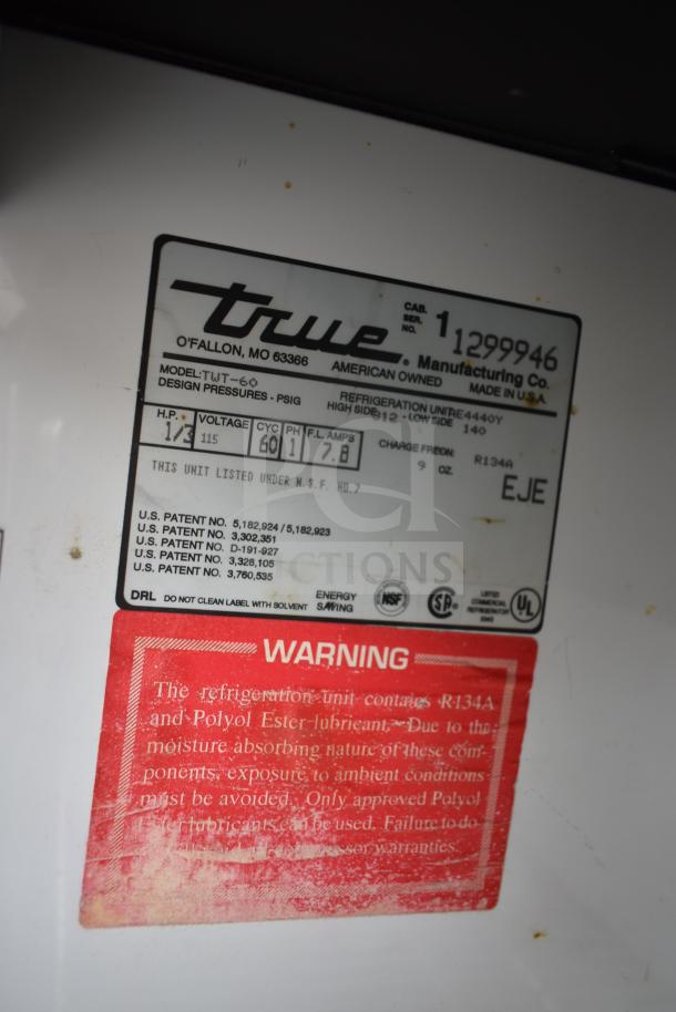 True TWT-60 Commercial Cooler label showing model, voltage (115V), phase (1), and R134A refrigerant warning.