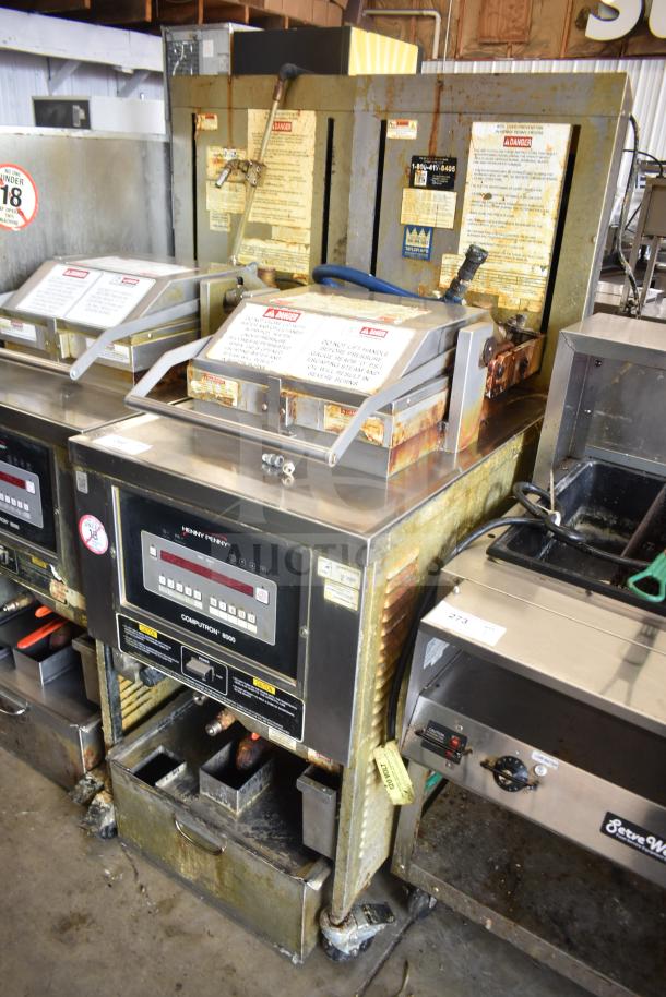 2020 Henny Penny PFG-691 Computron 8000 pressure fryer on casters, natural gas, 80,000 BTU, worn condition with visible labels.