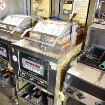 2020 Henny Penny PFG-691 Computron 8000 pressure fryer on casters, natural gas, 80,000 BTU, worn condition with visible labels.