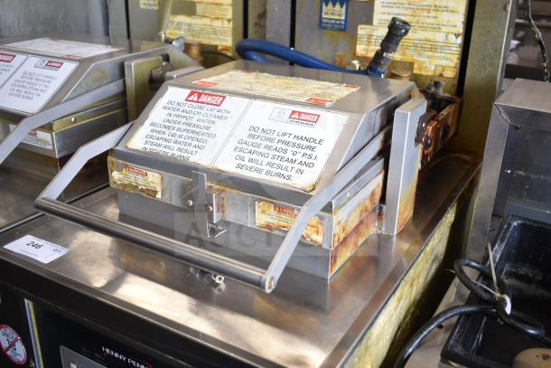 2020 Henny Penny PFG-691 Computron 8000 pressure fryer in used condition. Natural gas powered, 80,000 BTU, on commercial casters. Warning labels visible.