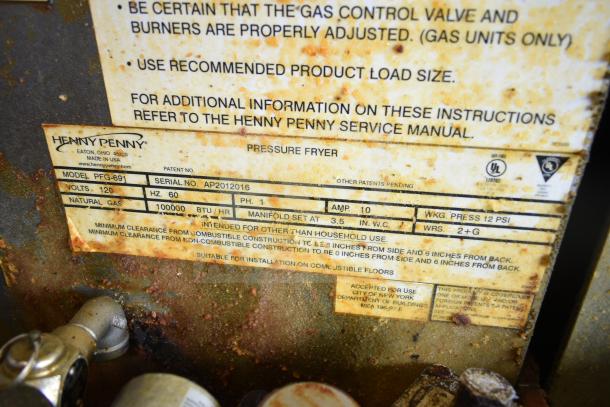 2020 Henny Penny PFG-691 Computron 8000 pressure fryer, natural gas, 80,000 BTU, commercial casters, worn label visible.
