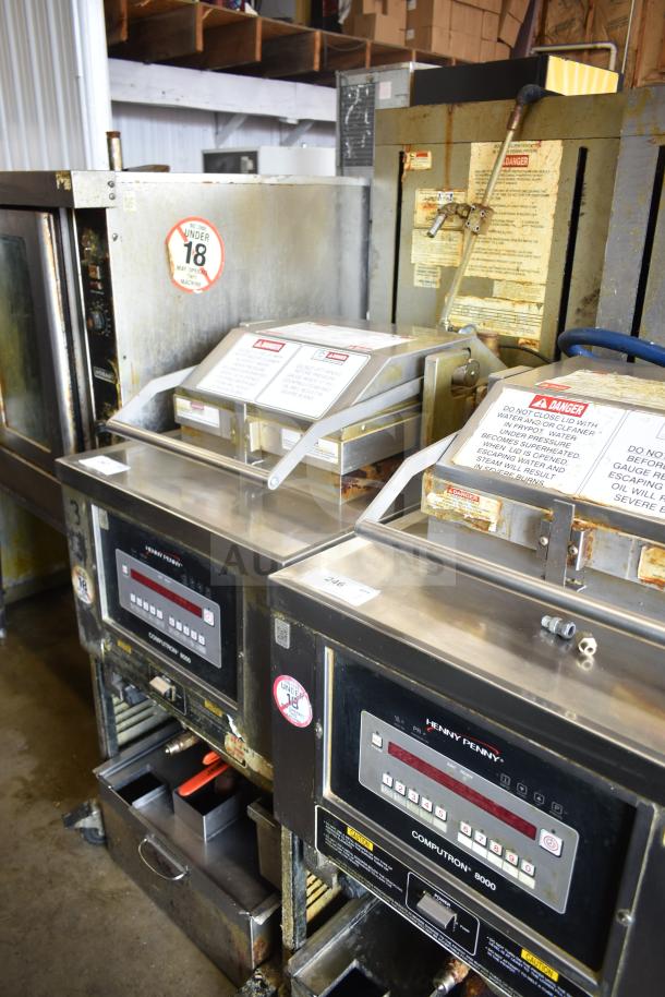 Henny Penny PFG-691 Computron 8000 commercial gas pressure fryer, 100,000 BTU, on casters. Control panel visible, fair condition.