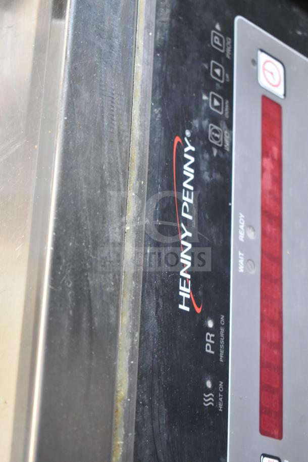 Henny Penny PFG-691 Computron 8000 pressure fryer control panel, showing branding and status indicators.