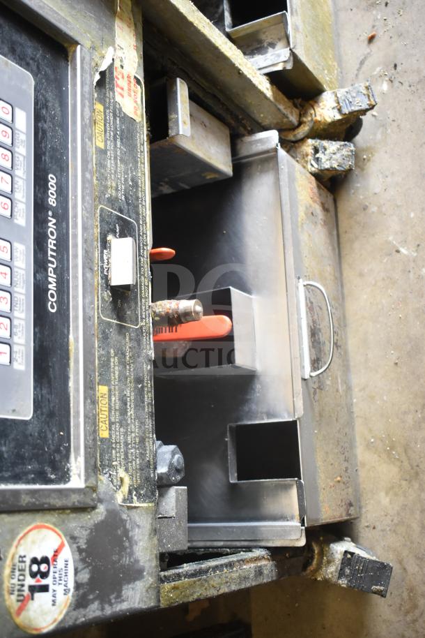 Henny Penny PFG-691 Computron 8000 pressure fryer, natural gas, 100,000 BTU, commercial casters, visible wear, caution labels.