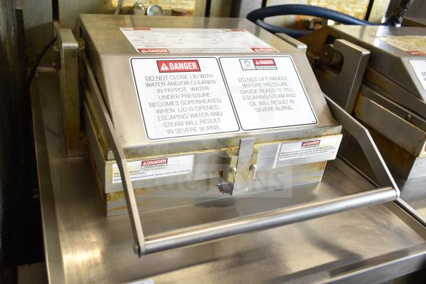 Henny Penny PFG-691 Computron 8000 pressure fryer, natural gas, on casters, 100,000 BTU, warning labels visible.