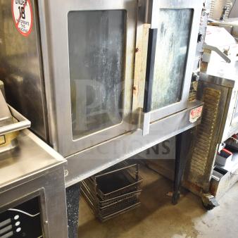 Hobart commercial full-size convection oven with view-through doors, thermostatic controls, metal legs, moderate wear.